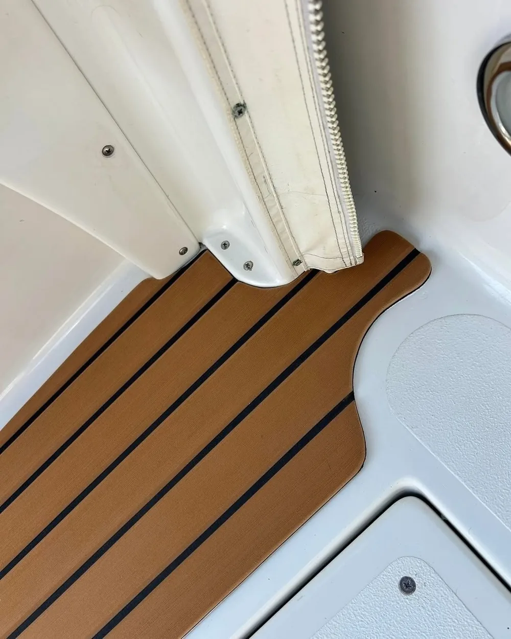 EVA teak cut neatly around a cockpit corner