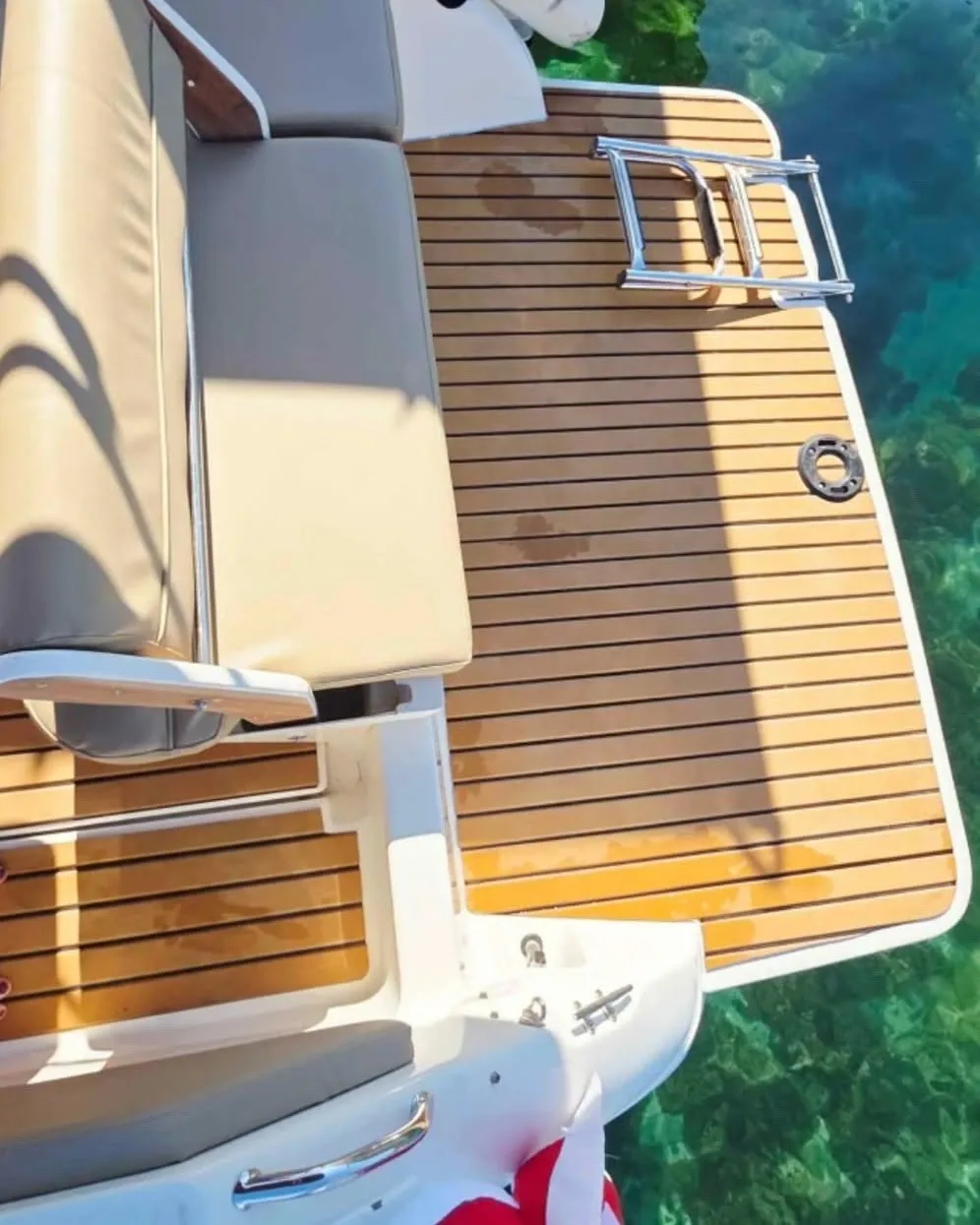 Swim platform decked in EVA foam teak over clear water